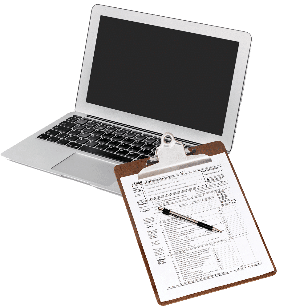tax form on clipboard on top of computer